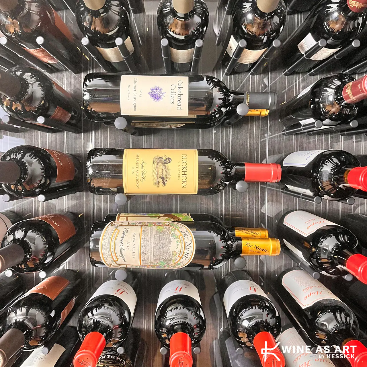 Three labels face-out among bottle bases on a dark panel.