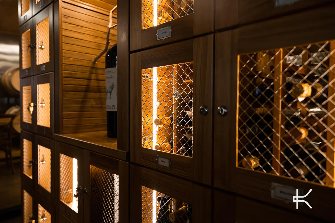 A row of timber wine lockers with lattice doors, seen at an angle.